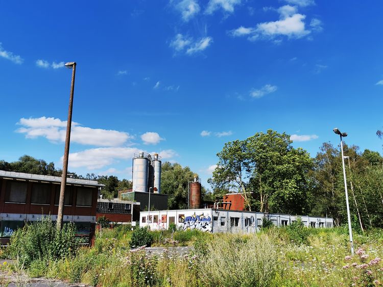 Der gleiche Blickwinkel auf das Areal Polsum 1 im Sommer 2020. Silos und Verwaltungscontainer stehen noch. © RAG Montan Immobilien GmbH, Fotograf: Stephan Conrad 