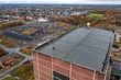 Drohnenfoto mit dem aufgestellten Stahl-Weihnachtsbaum auf dem Dach des Hammerkopfturms mit Blick auf Pelkum. Foto: RAG MOntan Immobilien/Thomas Stachelhaus